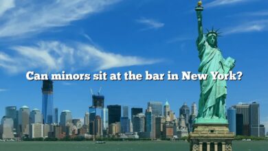 Can minors sit at the bar in New York?